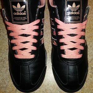 Black & pink Adidas samoa with floral print.